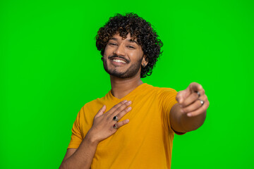 Amused bearded indian man pointing finger to camera, laughing out loud, taunting making fun of...