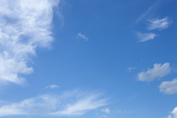 Naklejka na ściany i meble Blue sky with few clouds, sunny. Cloudscape.