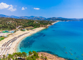 Beach and turquoise sea, umbrellas. Trypiti Beach, Thassos, Greece