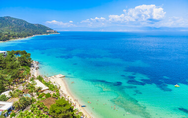 Beach and turquoise sea, palm trees. La Scala Beach, Thassos, Greece