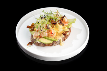 Toast with shrimp, prawns, avocado and poached egg