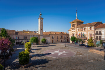 Fototapeta na wymiar Plaza de Espana Square with Clock Tower (Torre del Reloj) and Consuegra City Hall - Consuegra, Castilla-La Mancha, Spain