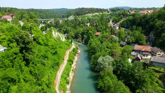 Aerial shot drone flies along river in Rastoke, Croatia