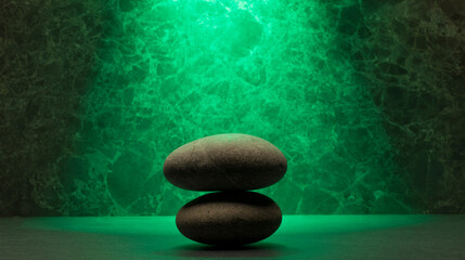 zen stones on green background for product presentation