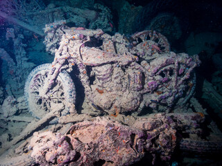 Motobikes or motocycles inside the ship wreck of the SS Thistlegorm in the Red Sea, Egypt.  Underwater photography and travel.