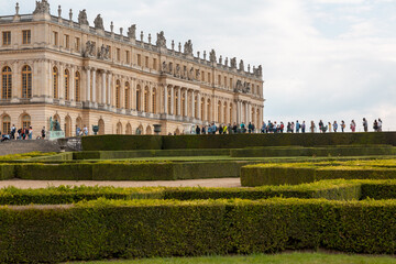 Paris, France - May 20, 2023: exterior, architecture and park outdoors of the Palace Versailles royal chateau UNESCO list of World Heritage Sites.