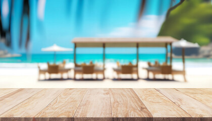 Empty wood table top and blurred seaside restaurant in a tropical resort in summer banner background - can use for display or montage of your products.