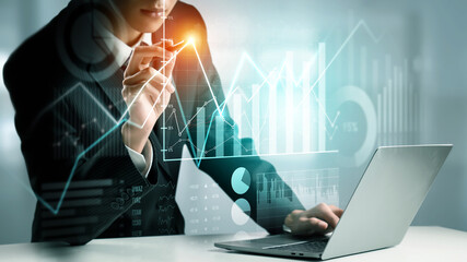 Businessman analyst working with digital finance business data graph showing technology of...