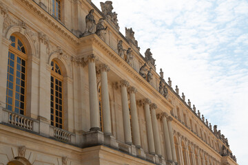 Paris, France - May 20, 2023: exterior, architecture and park outdoors of the Palace Versailles royal chateau UNESCO list of World Heritage Sites. - obrazy, fototapety, plakaty