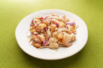 Fresh chicken thigh pieces on a monochrome background