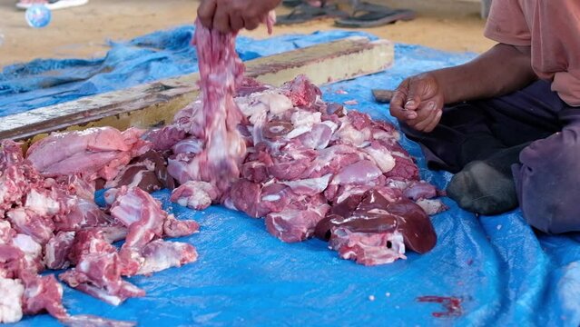The process of cutting halal qurbani meat per part. Sacrifice Day