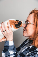 girl and a guinea pig