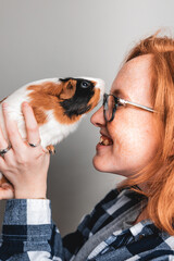 woman and a guinea pig