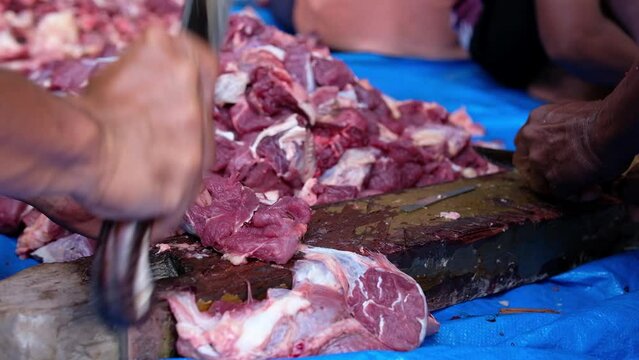 The process of cutting halal qurbani meat per part. Sacrifice Day