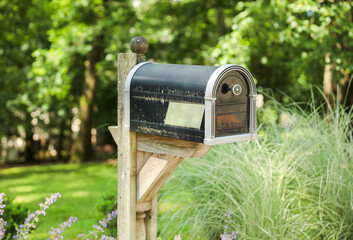 mailbox stands tall against a backdrop of greenery, symbolizing communication, connection, and the exchange of thoughts and emotions