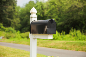 mailbox stands tall against a backdrop of greenery, symbolizing communication, connection, and the exchange of thoughts and emotions