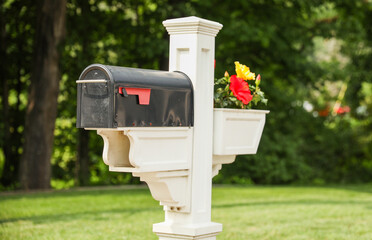 mailbox stands tall against a backdrop of greenery, symbolizing communication, connection, and the exchange of thoughts and emotions