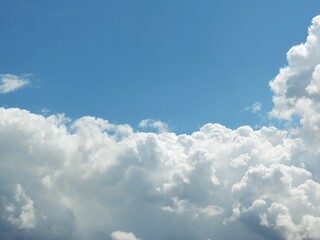 Naklejka na ściany i meble Blue sky with cloud masses texture