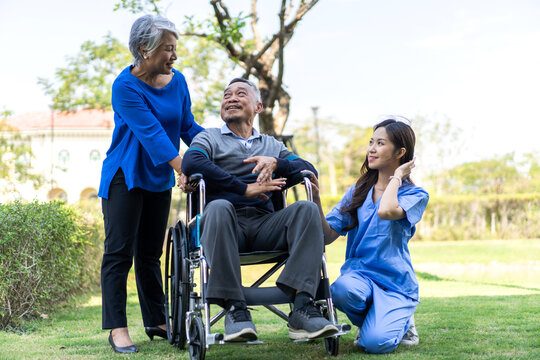 Portrait Of Smiling Caring Asian Nurse Service Help Support Discussing And Consulting Taking Care With Senior Elderly Asian Man And Woman Couple At Home Visit.senior Retirement Home Care Concept