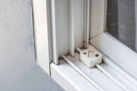 Dust on window sills and tracks corner,  these areas need cleaning.