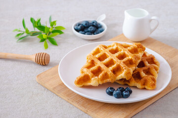 Croffle or croissant waffle with blueberries on plate
