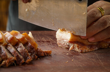 Fresh pork head being sliced