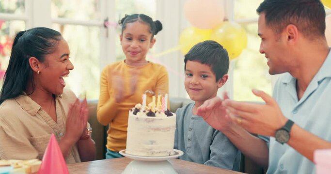 Birthday cake, clapping and happy child blowing candle flame for youth celebration, fun home party or excited family event. Parents love, special cheers and kid boy, mom and dad smile for dessert