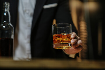 Barman pouring whiskey whiskey glass beautiful night