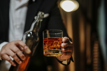 Barman pouring whiskey whiskey glass beautiful night
