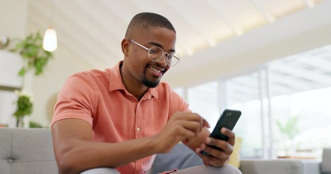 Happy, typing and a black man with a phone on the sofa for social media, connection or communication. Smile, relax and an African person with a mobile for an app, email or notification in a house