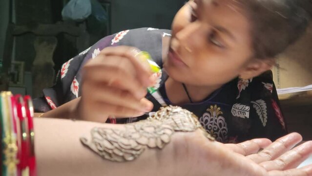 Traditional Indian temporary tattoo realized with henna paste during the Mehndi ceremony.