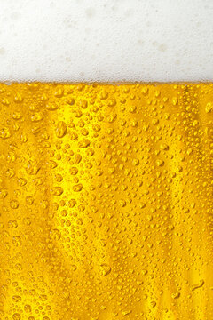 Beer. Light beer with bubbles and foam background