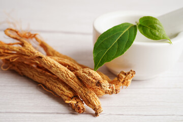 Ginseng roots and green leaf, healthy food.