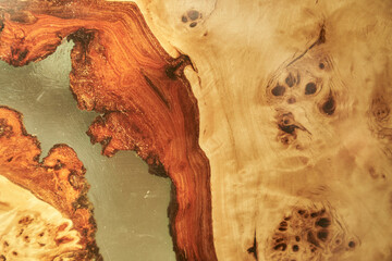 The background is made of wood and transparent epoxy resin in the middle with space for copying....