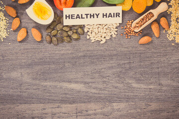 Nutritious products containing differents vitamins or minerals for healthy hair. Copy space for text
