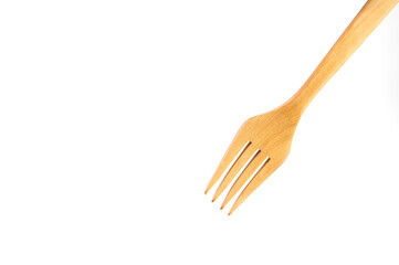 a wooden fork on a white background