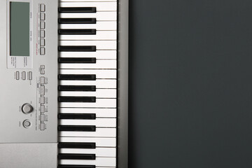 Fototapeta na wymiar Modern synthesizer keyboard on black background
