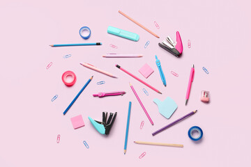 Composition with stationery supplies on pink background