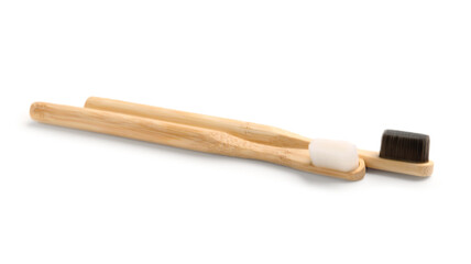 Bamboo tooth brushes on white background