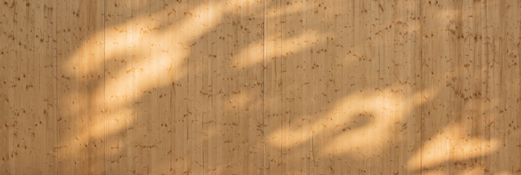 Texture of a wooden wall showing light and shadow