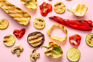 Tasty grilled vegetables on pink background