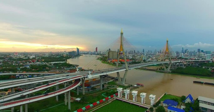 Aerial View of Bangkok and the Bhumibol Bridge inter-city expressway .Across the Chao Phraya River and ring road systems on the outer edge of Bangkok Metropolitan..beautiful King Bhumibol suspension 