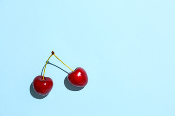 Sweet cherries on blue background