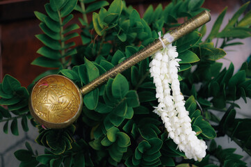 a golden scoop for ceremonial wedding traditional in asia