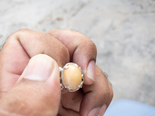 hand holding a ring 