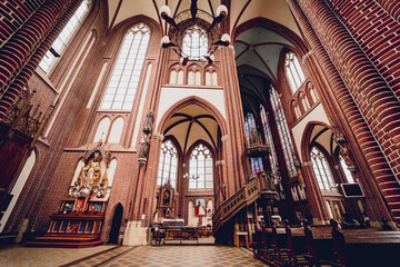 Fototapeta na wymiar Interior of the main nave of old european catholic church