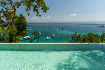 Luxury hotel infinity pool in summer