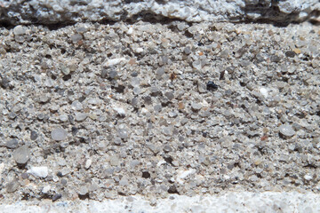 texture of old cement mortar in brickwork, sand and granite chips are visible, background with empty space