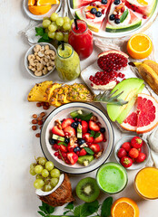 Summer fruits assorted on white background. Fresh raw food concept.