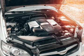 A Closeup of the Horizontally Opposed 6-Cylinder Boxer Engine Under the Hood - Revealing the Clean and Powerful Motor Block of a Sports Car. The engine under the hood.